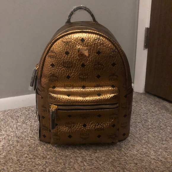 mcm backpack gold